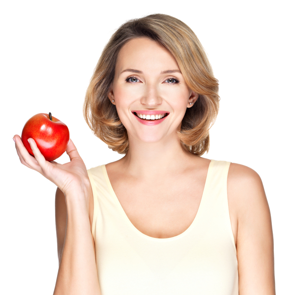 手拿苹果的健康牙齿女性图片