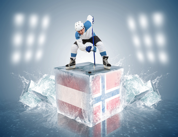 带国旗图案的冰块上的打冰球的运动员图片