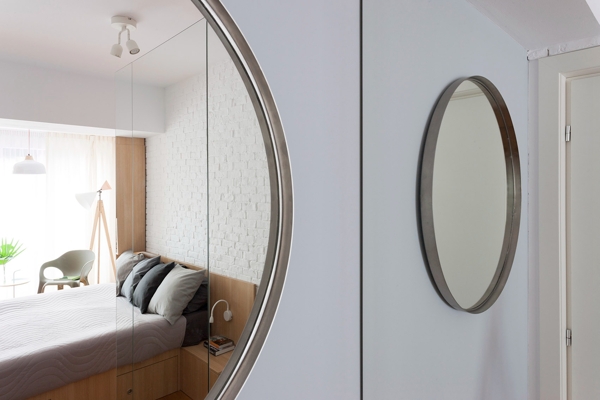 现代时尚卧室圆形镜子柜子室内装修效果图